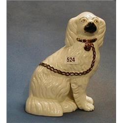 A Victorian Staffordshire figure of a seated Spaniel 9" (crack to the base) ILLUSTRATED  £20-40...