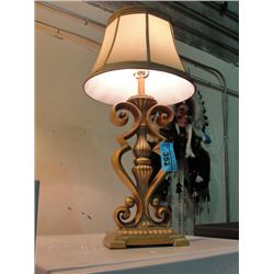 Fancy guild on ceramic based table lamp