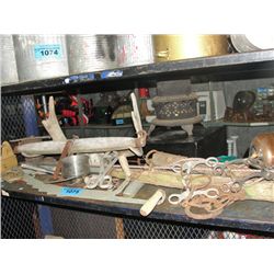 Shelf lot of rustic farm tools