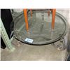 Image 1 : Round bevelled glass top cocktail table with