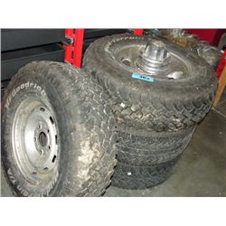 Set of 4 mismatched tires with 3 dodge ram rims