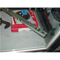 Carpenters level, 2 saw blades and 2 boxes of