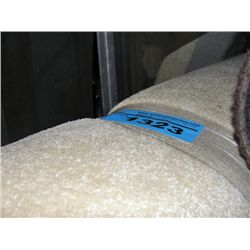 One roll of off white new carpeting