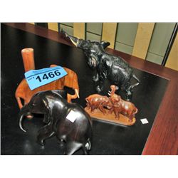 Group of 4 decorative wooden elephants