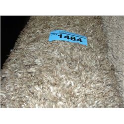 Large beige shag area rug