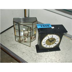 small mantel clock and brass and glass display