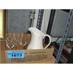 Glass liqour decanter with wine glasses and one