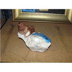 Decorative seal and pup figurine on white quartz