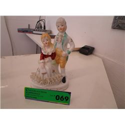 China figurine of a seated man and woman