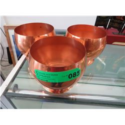 Three copper bowls