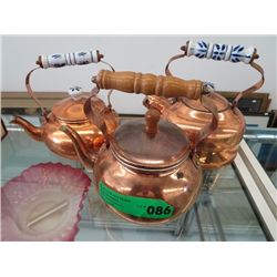 Two copper teapots and a copper kettle