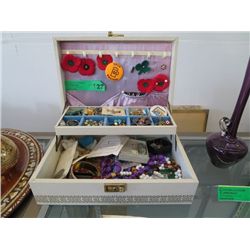 White leather jewel box of costume jewelry