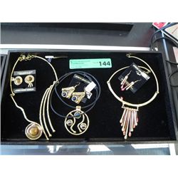 Three sets of necklaces and earrings