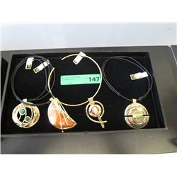 Four African necklaces, tray not included