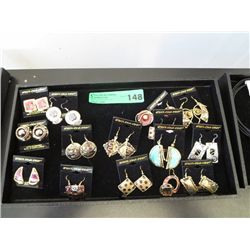 14 pairs of African earrings, tray not included