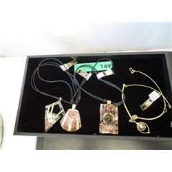 Four African made necklaces, tray not included