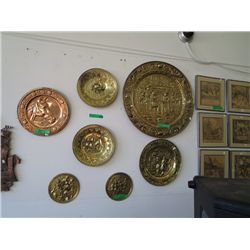 6 pieces of brass wall art and one copper