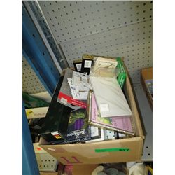 Box of new candles and picture frames