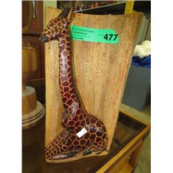 Wooden carving of a giraffe
