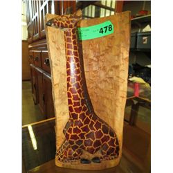 Wooden carving of a giraffe