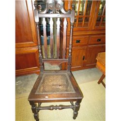 Antique wooden chair with wicker seat