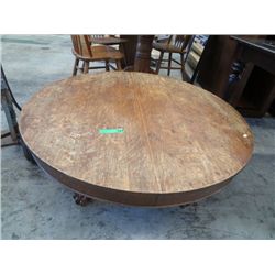 Round oak pedestal base coffee table