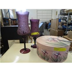 Hat box and two glass stemmed purple vases