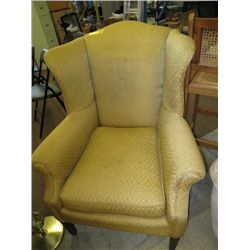Upholstered wing back armchair