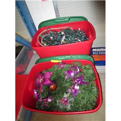 Two totes of Christmas lights and decorations
