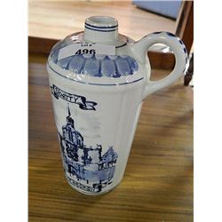 GREEN GLASS CARBOUY IN WICKER