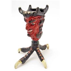15206 - CAST IRON DEVIL FACE CANDLESTICK HOLDER