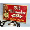 Image 1 : 1 OLD MILWAUKEE BEER IN QUARTER GALLONS METAL SIGN. H11",L17.5 SOME RUST. WEIGHT 1LB....