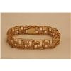 Image 1 : ONE 14KT YELLOW GOLD, CONTEMPORARY DESIGN, FLEXIBLE LINK BRACELET. THE BRACELET IS 15.80 MM WIDE