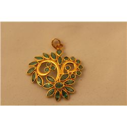 ONE STAMPED 18KT YELLOW GOLD HAND MADE SWIRL STYLE BEZEL SET EMERALD PENDANT, SET WITH NUMEROUS