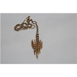 ONE 18KT YELLOW GOLD AND WHITE GOLD HAND MADE DIAMOND SET SLIDER STYLE PENDANT. THE RING IS MADE IN