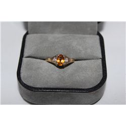 STAMPED 10KT YELLOW GOLD DIAMOND GEMSTONE RING. NATURAL CITRINE 0.48 CARAT ACCOMPANIED BY 0.04