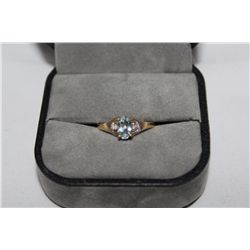 STAMPED 10KT YELLOW GOLD DIAMOND AQUAMARINE RING. NATURAL AQUAMARINE 0.35 CARAT ACCOMPANIED BY 0.04