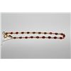Image 1 : ONE LADIES 18KT YELLOW GOLD RUBY BRACELET. NATURAL RUBY 5.26 CARATS, OVAL CUT, PINKISH-RED ITEM