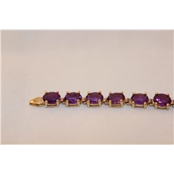 STAMPED 10KT YELLOW GOLD AMETHYST BRACELET. GEMSTONE: 19.00 CARATS ITEM WEIGHT: 10.57 GRAMS