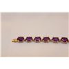 Image 1 : STAMPED 10KT YELLOW GOLD AMETHYST BRACELET. GEMSTONE: 19.00 CARATS ITEM WEIGHT: 10.57 GRAMS
