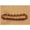 Image 2 : STAMPED 10KT YELLOW GOLD AMETHYST BRACELET. GEMSTONE: 19.00 CARATS ITEM WEIGHT: 10.57 GRAMS