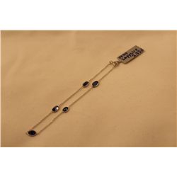 STAMPED 14KT WHITE GOLD SAPPHIRE BRACELET. GEMSTONE: 2.55 CARATS ITEM WEIGHT: 1.3 GRAMS