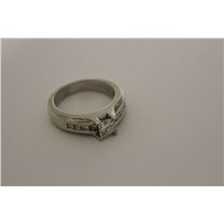 ONE LADIES 14KT WHITE GOLD DIAMOND SET ENGAGMENT OR DRESS RING. THE RING IS 6MM WIDE AND FEATURES A