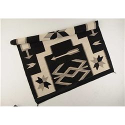 Finely woven Navajo rug with unusual storm pattern and Valero stars and arrows. The rug measures 84”