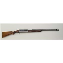 Cosmi 12 gauge semi-automatic best quality shotgun showing 35 ¼” barrel with deluxe scroll engraving