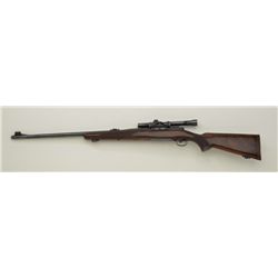 Winchester Model 70 bolt action rifle, .375 Magnum cal., 25” barrel, blue finish, checkered wood sto