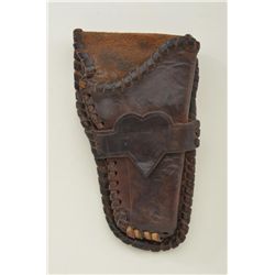 Handmade Western-style single loop holster for 4 ¾” Colt single action showing heart at center in go