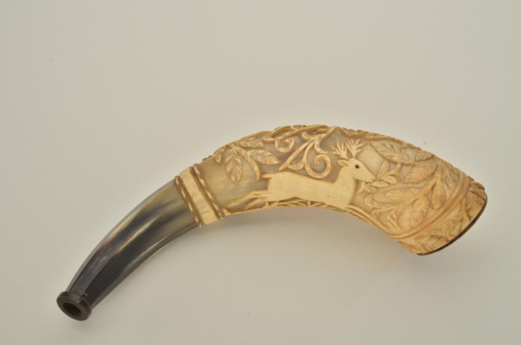 Mexican powder horn from mid19th century carved in high relief showing