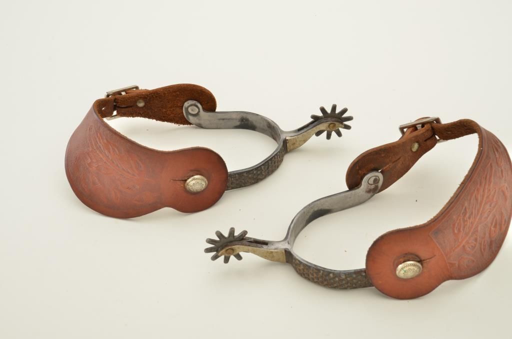 Old West spurs with gooseneck shanks, rasp pattern bodies, silver