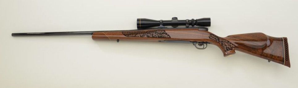 Weatherby Mark V Bolt Action Rifle In 257 Weatherby Magnum Caliber Fancy Laser Mark Decorated Burl Weatherby Mark V Bolt Action Rifle In 257 Weatherby Magnum Caliber Fancy Laser Mark Decorated Burl